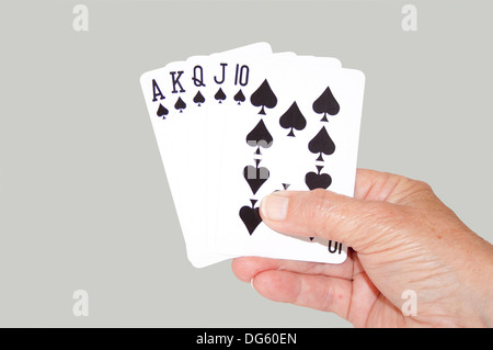 Isolierte Hand gehalten Royal Flush Pik Stockfoto