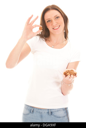 Junge Frau mit typisch holländischen Süßigkeiten Pepernoten isoliert Stockfoto