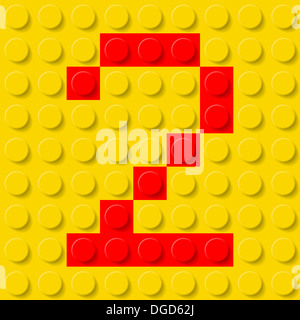 Rote Nummer zwei im gelben Kunststoff-Bausatz. Schrift-Probe. Stockfoto