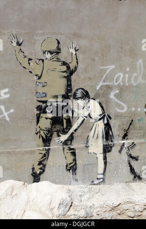 Wand mit einem Graffito von Banksy, palästinensischer Seite zwischen Bethlehem, Westjordanland und Jerusalem, Israel, Nahost Stockfoto