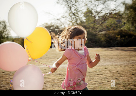 Mädchen mit Luftballons Stockfoto