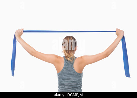 Pferdeschwanz Frau training mit einem Widerstand band Stockfoto