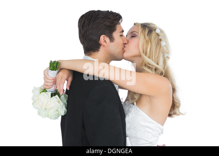Glücklich attraktive verheiratetes Paar küssen einander posiert Stockfoto