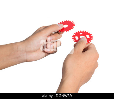 Entwerfen eines mechanischen Systems mit roten Zahnrad Zahnräder Mann. Stockfoto