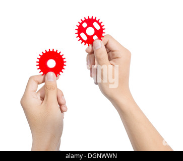 Entwerfen eines mechanischen Systems mit roten Zahnrad Zahnräder Mann. Stockfoto