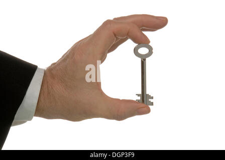 Business-Mann Hand mit einem sicheren Schlüssel, symbolisches Bild für Verantwortung Stockfoto