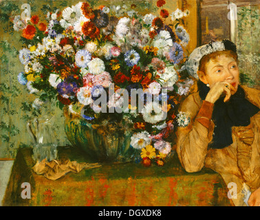 Eine Frau sitzt neben einer Vase mit Blumen - von Edgar Degas, 1865 Stockfoto