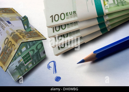 Haus und einen Haufen Geld Stockfoto