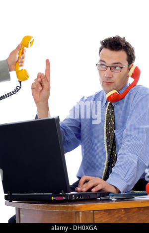 Geschäftsmann am Telefon zu sprechen, während jemand anderes auf dem Spiel steht Stockfoto