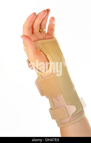 Hand mit einem orthopädischen Handgelenkbandage Stockfoto