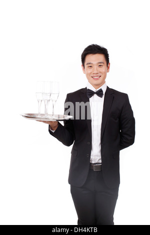 Mann im Smoking eine Halteplatte Stockfoto