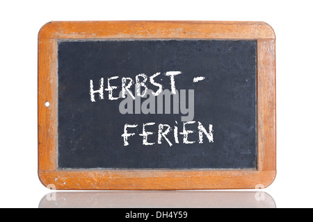 Alte Schultafel mit dem Begriff HERBSTFERIEN, Deutsch für Herbstferien Stockfoto