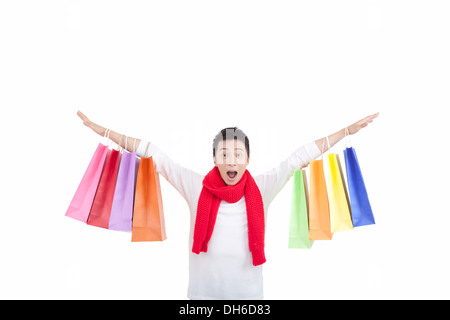 Junger Mann Holding Shopping bags Stockfoto