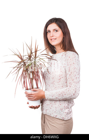 junges Mädchen mit Draceana in Händen Stockfoto