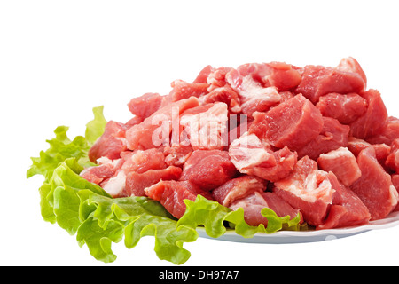 Frisches rohes Fleisch und Salat isoliert auf weiss Stockfoto