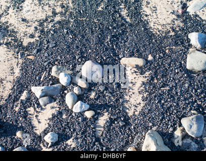 Meer Kohle am Strand in Blyth, Northumberland, England, UK Stockfoto