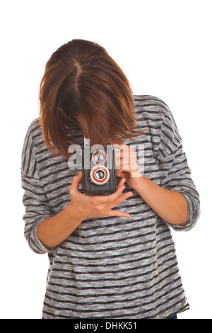 Schöne Teenager-Mädchen mit Retro-Foto-Kamera Stockfoto