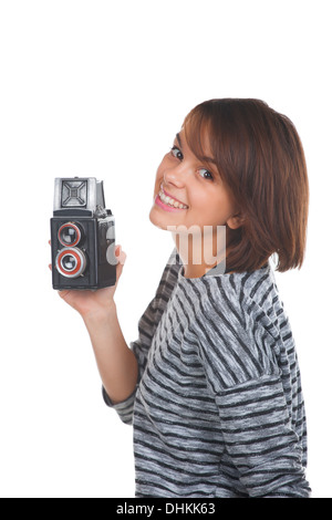 Schöne Teenager-Mädchen mit Retro-Foto-Kamera Stockfoto