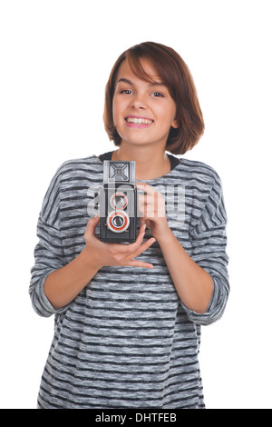 Schöne Teenager-Mädchen mit Retro-Foto-Kamera Stockfoto