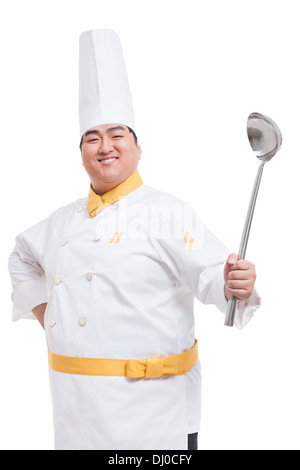 Fröhliche Chubby Kochen mit Schöpfkelle Stockfoto