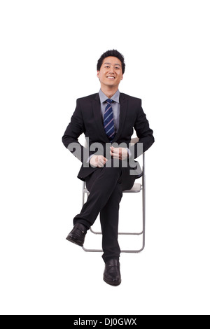 Fröhliche Geschäftsmann Sitzhaltung Stockfoto