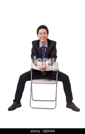 Fröhliche Geschäftsmann Sitzhaltung Stockfoto