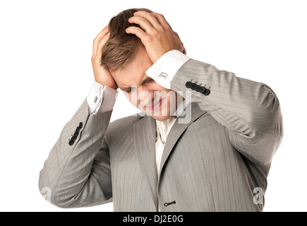 Junger Mann im Anzug, die unter Kopfschmerzen leiden Stockfoto