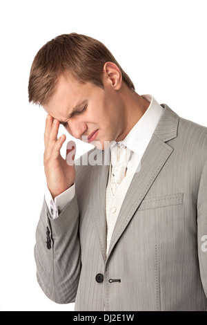 Junger Mann im Anzug, die unter Kopfschmerzen leiden Stockfoto