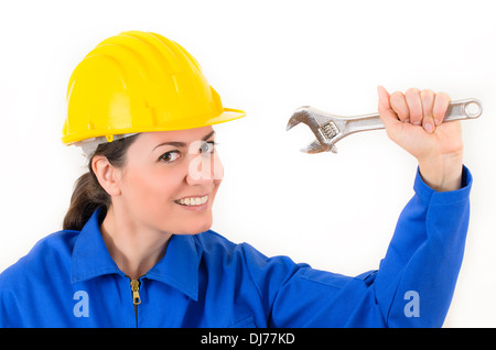 Frau trägt Schutzausrüstung mit verstellbaren Schraubenschlüssel Stockfoto