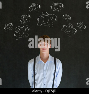 Geschäftsmann mit fliegenden Geld Sparschweine in Kreide auf Tafel Hintergrund Stockfoto