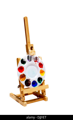 hölzerne Staffelei mit leuchtend bunten Farben-palette Stockfoto