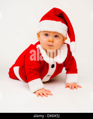 Baby Boy in Santa Outfit bereit für Weihnachten Stockfoto