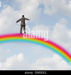 Erfolg-Reise-Business-Konzept mit einem Geschäftsmann hoch oben in den Himmel zu Fuß auf einem Regenbogen als Metapher für die finanzielle Möglichkeit Richtung und Reichtum Strategie indem Sie eine gewinnende Plan führt zu Glück. Stockfoto