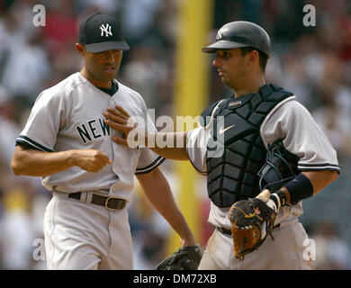 New York Yankees' Mariano Rivera hugs Andy Pettitte as Derek Jeter and  catcher J.R, Murphy, right, and Robinson Cano, left, look on during the  ninth inning of a baseball game against the