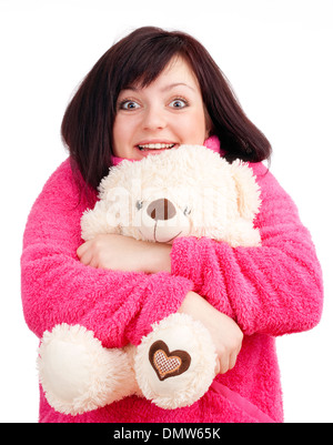 Junge Frau in rosa Bademantel kuscheln mit ihr Teddy Bär Stockfoto