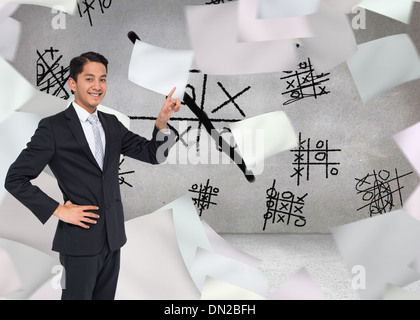 Zusammengesetztes Bild des lächelnden asiatischen Geschäftsmann zeigen Stockfoto