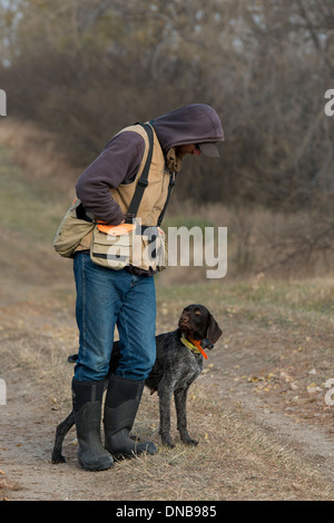 Ein Jäger und sein Hund Stockfoto