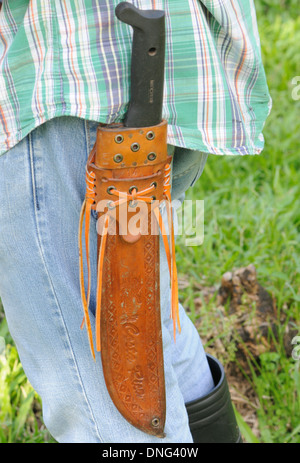 Eine Machete und Gummistiefeln sind Eswential Ausrüstung für alle Costa Rica Landarbeiter. Stockfoto