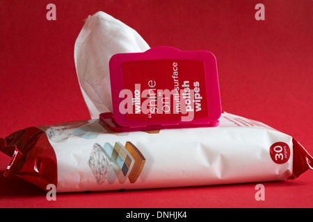 packet of Wilko shine on multi-surface polish wipes opened to show contents set on red background Stockfoto