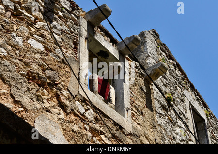 Plomin Istrien Kroatien alte Fischer Dorf Details menschliche Figur in das Fenster Stockfoto