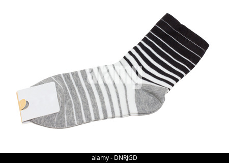 Neue Socken mit Label isoliert auf weiss. Stockfoto