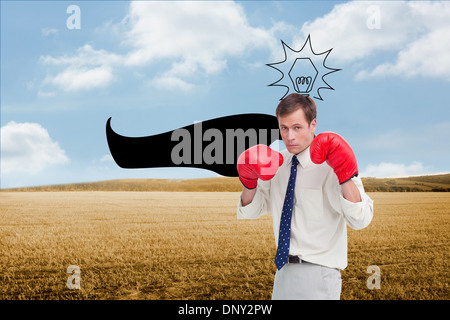 Zusammengesetztes Bild der Geschäftsmann mit seinem Boxhandschuhe bereit zu kämpfen Stockfoto