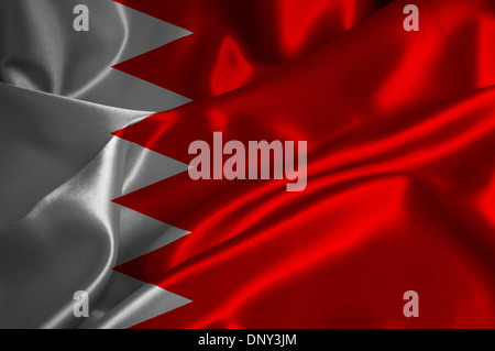 Bahrain Flagge auf seidige Textur. Stockfoto