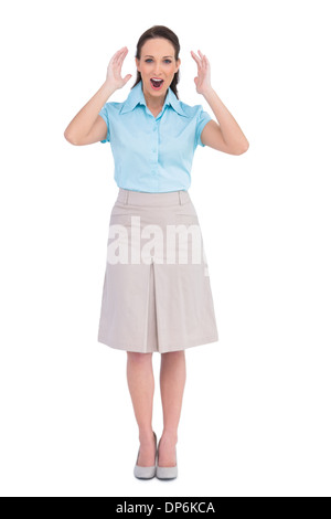 Überrascht, stilvolle Geschäftsfrau posiert Stockfoto