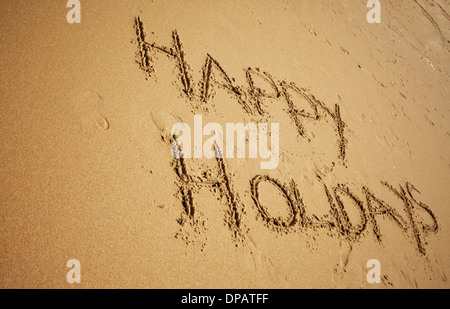 Nachricht oder Gruß in Sand am Strand geschrieben Stockfoto