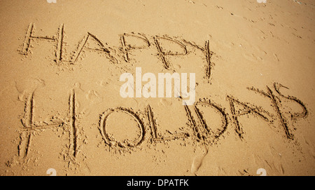 Nachricht oder Gruß in Sand am Strand geschrieben Stockfoto