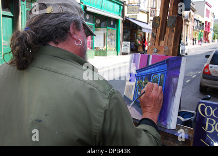 Künstler in Glastonbury High Street, Somerset UK Stockfoto