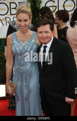 Los Angeles, USA. 12. Januar 2014. Fox und Frau Tracy Pollan teilnehmen 71st Annual Golden Globe Awards aka Golden Globes im Hotel Beverly Hilton in Los Angeles, USA, am 12. Januar 2014. Foto: Hubert Boesl/Dpa/Alamy Live News Stockfoto