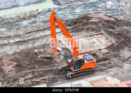 Orange Bagger auf der Baustelle Stockfoto