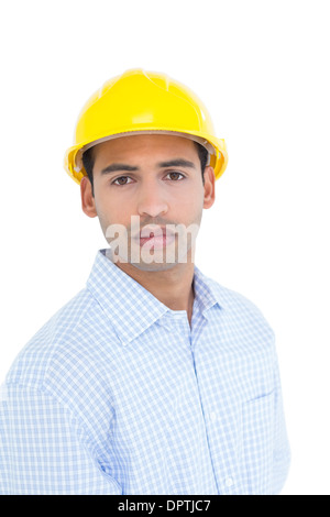 Porträt einer schweren Handwerker tragen einen gelben Schutzhelm Stockfoto